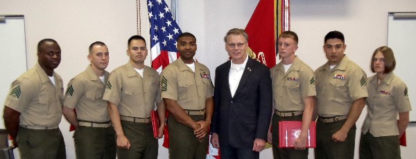 Joining together for an awards presentation in April are (l-r) Sgt. Michael Webster, USMC; Sgt. Christopher Davis, USMC; Cpl. Huber Basurto, USMC; Master Sgt. Robert Lewis, USMC, guest speaker; Mark Witzel, chapter president; Cpl. Coty Thompson, USMC; Sgt. Miguel Machado, USMC; and Sgt. Jamie Kubik, USMC.